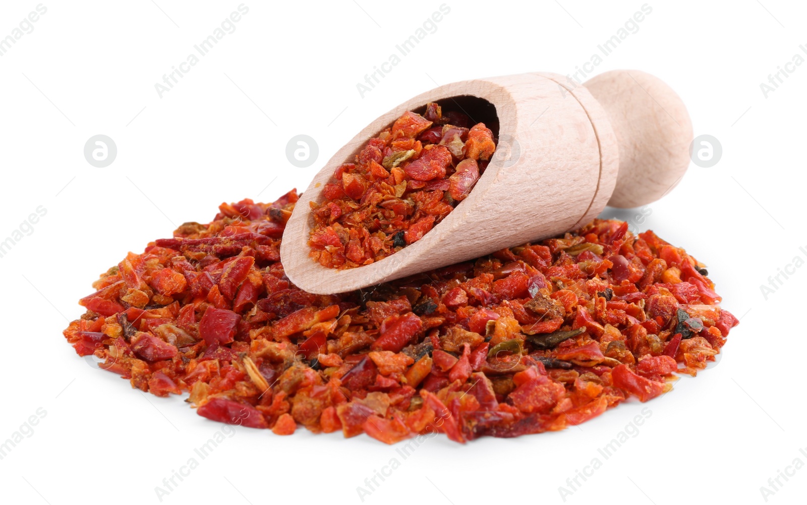 Photo of Aromatic spice. Pile of red chili pepper flakes and scoop isolated on white