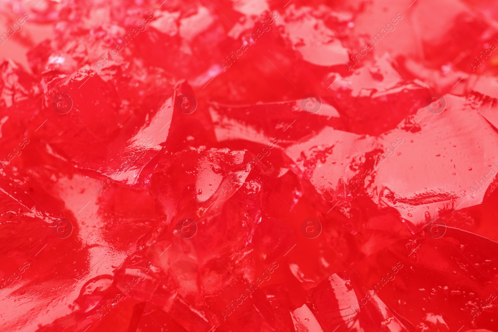 Photo of Red tasty fruit jelly as background, closeup