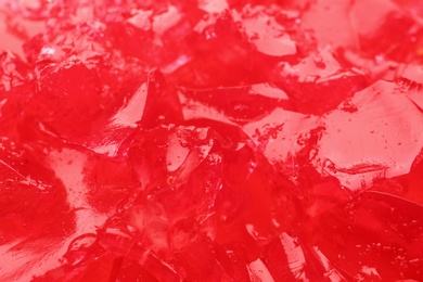 Photo of Red tasty fruit jelly as background, closeup