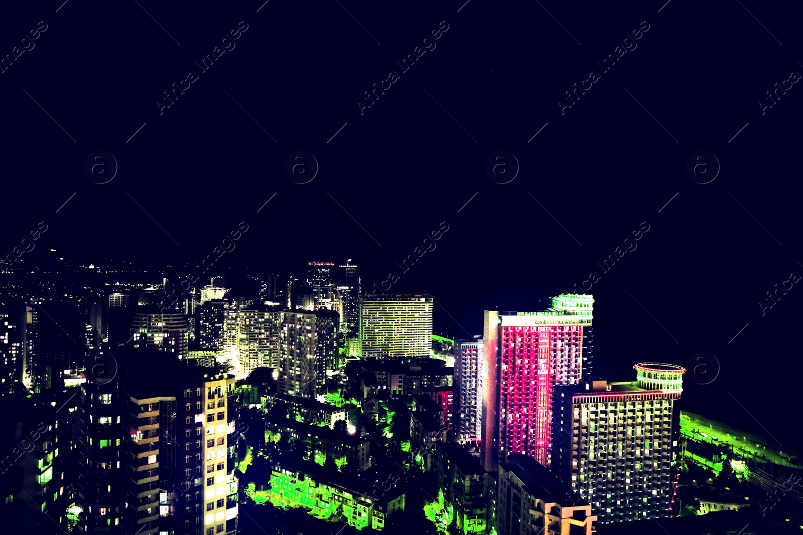 Image of Dark cityscape with beautiful neon lights. Modern metropolis