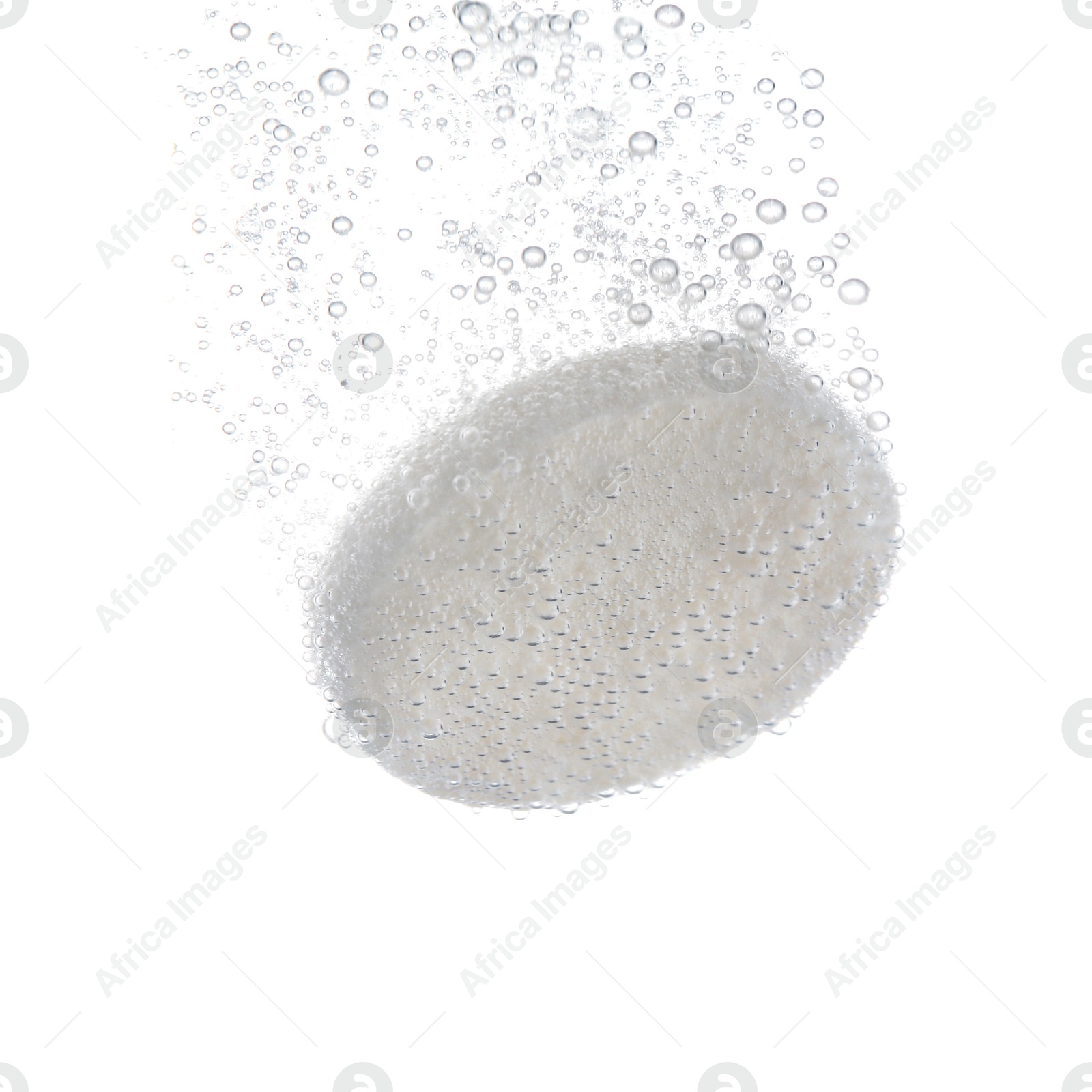 Photo of Effervescent pill dissolving in water on white background, closeup