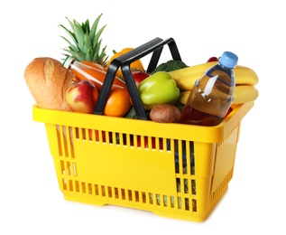 Shopping basket with grocery products on white background