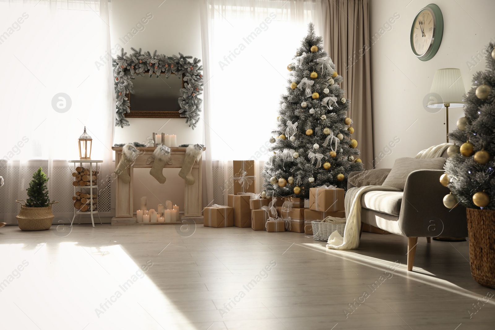 Photo of Stylish Christmas interior with beautiful decorated tree and fireplace