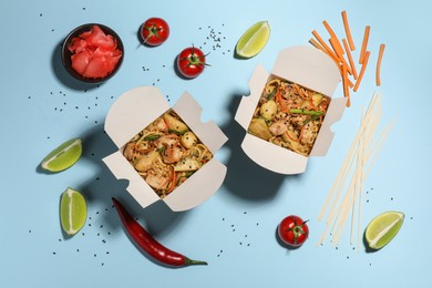 Flat lay composition with noodle wok and ingredients on light blue background