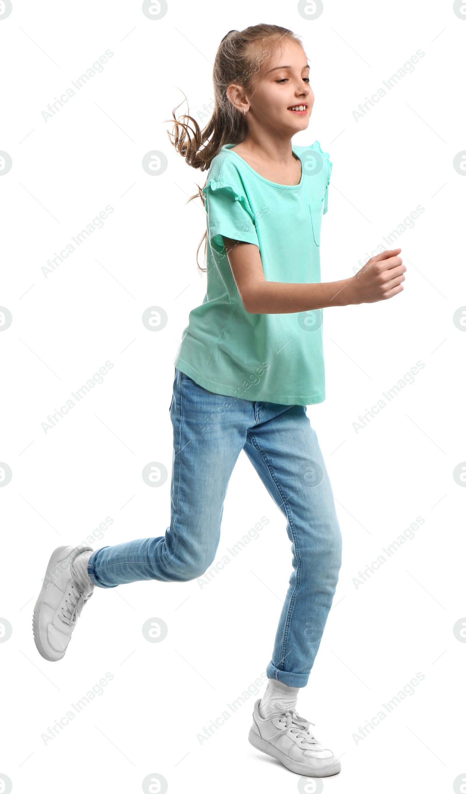 Photo of Cute little girl running on white background