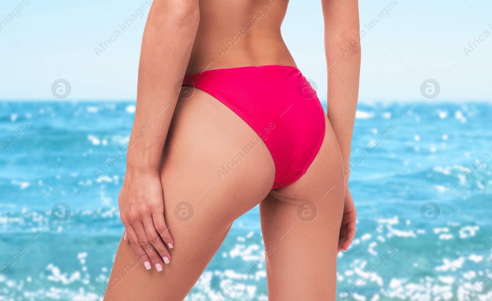 Image of Woman in stylish pink bikini near sea, closeup. Banner design