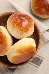 Freshly baked soda water scones on white wooden table, flat lay