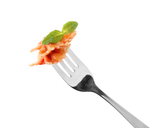Photo of Delicious farfalle pasta with tomato sauce on fork against white background