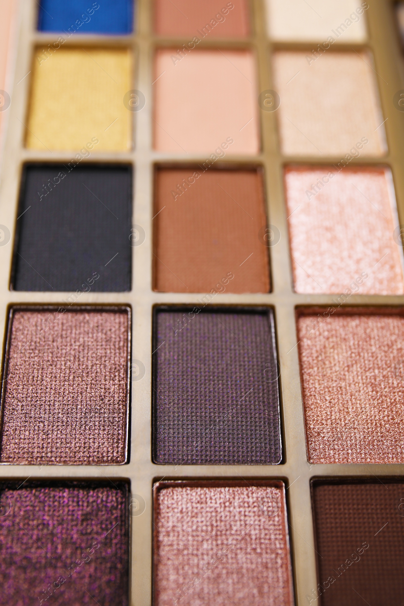 Photo of Beautiful eyeshadow palette as background, closeup. Professional cosmetic product