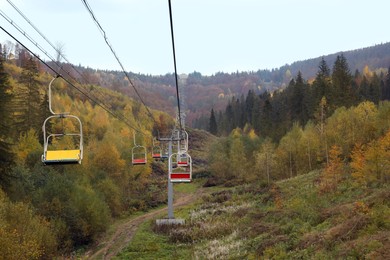 Chairlift with comfortable seats at mountain resort