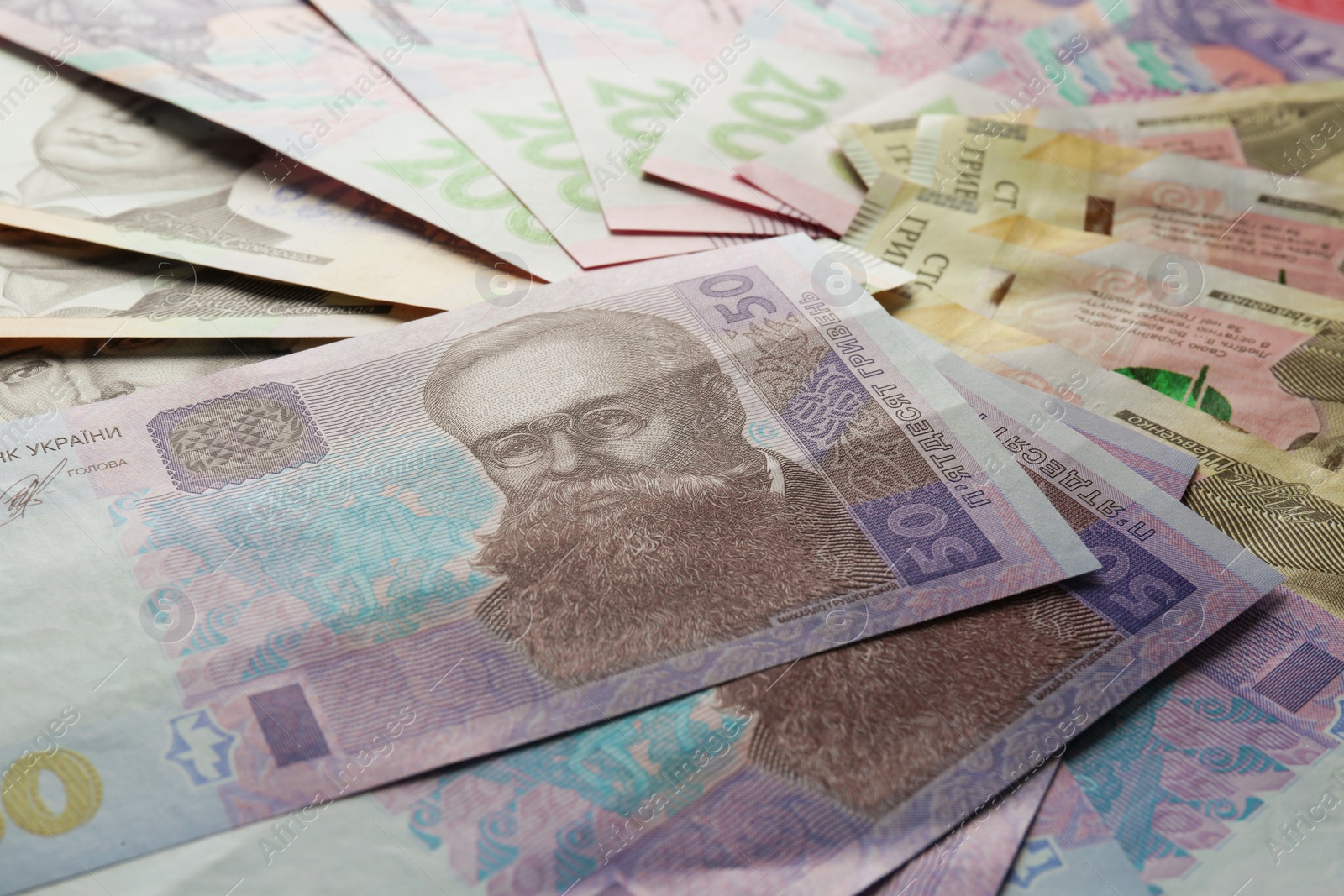 Photo of Different banknotes of Ukrainian money, closeup. National currency