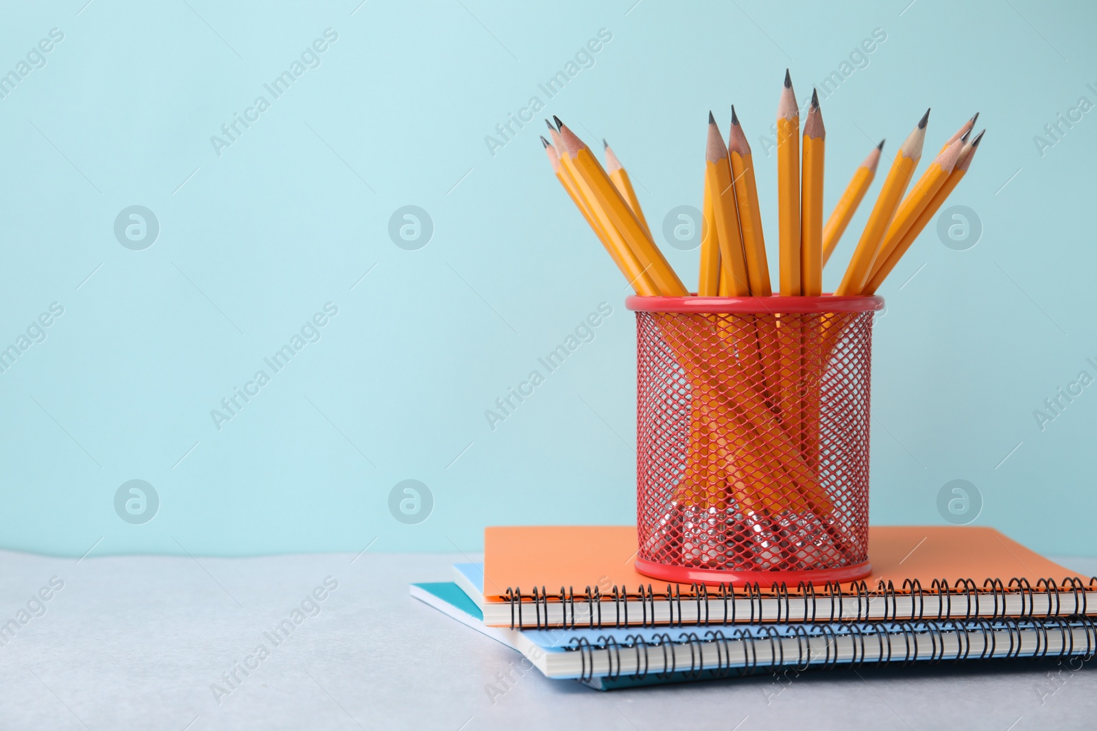 Photo of Different school stationery on table against light blue background, space for text. Back to school