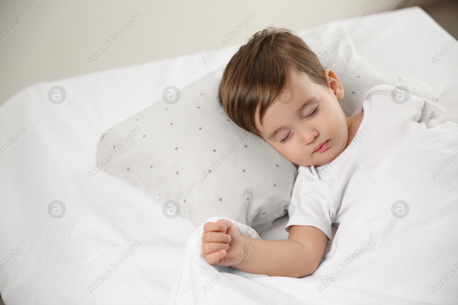 Photo of Cute little baby peacefully sleeping at home. Bedtime