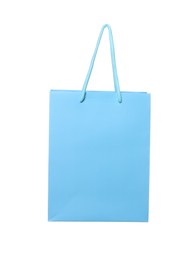 Photo of One light blue shopping bag isolated on white