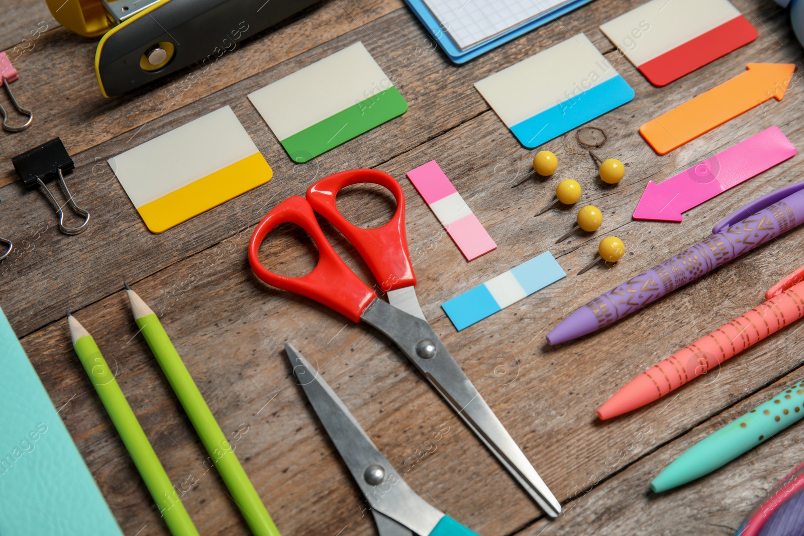 Photo of Different stationery on wooden table. Back to school