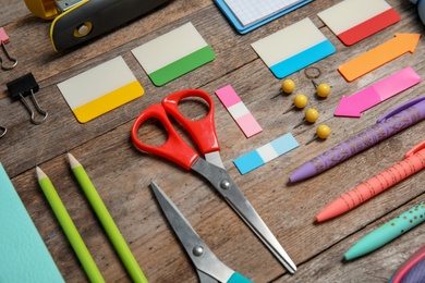 Photo of Different stationery on wooden table. Back to school