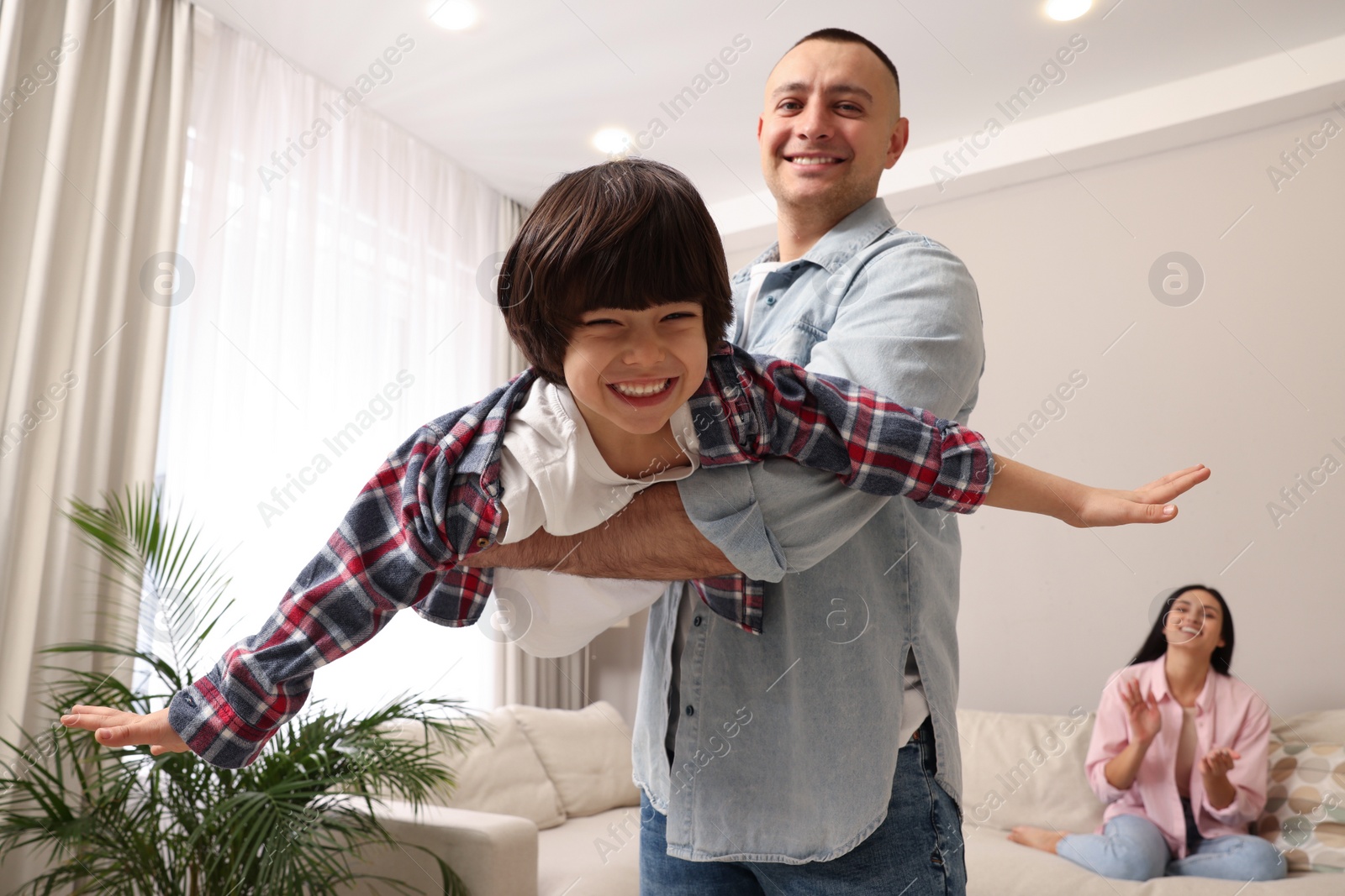 Photo of Happy family spending time together at home