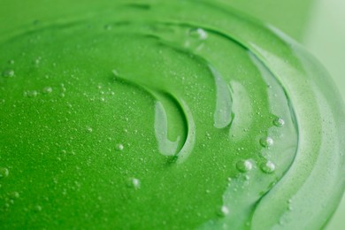 Texture of green shower gel as background, closeup