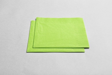 Photo of Clean napkins on grey background. Personal hygiene