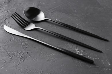 Photo of Set of beautiful cutlery on black table