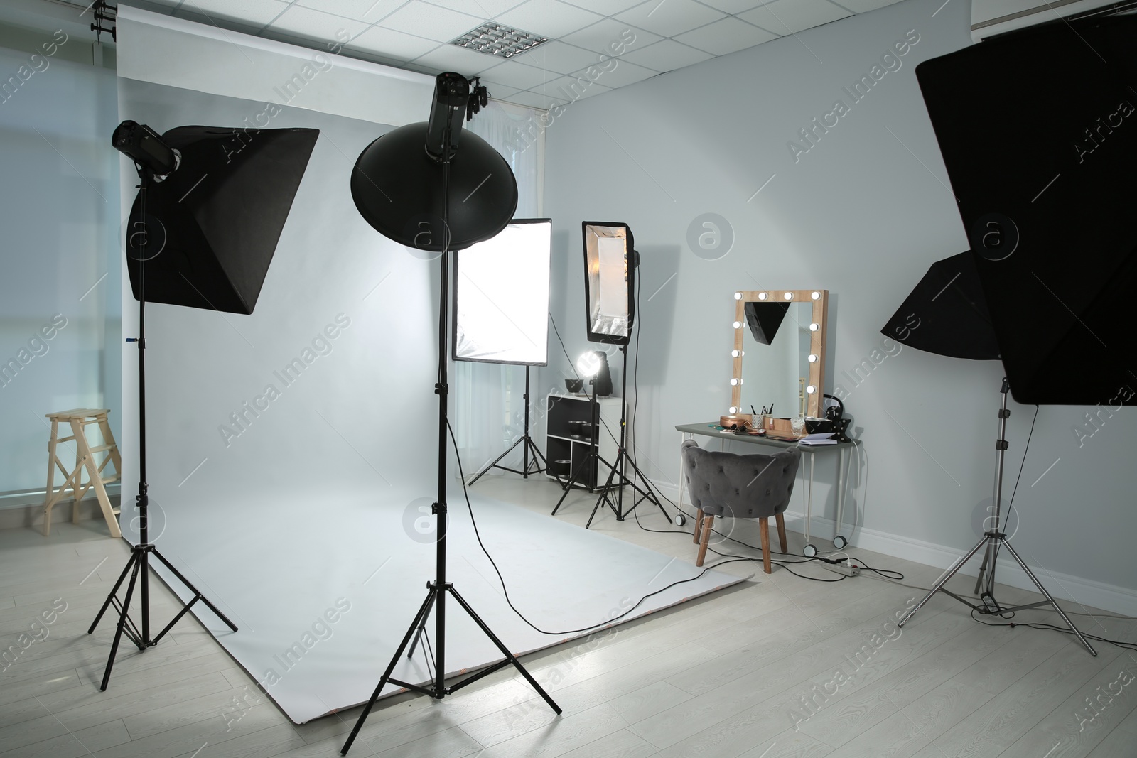 Photo of Interior of modern photo studio with professional equipment