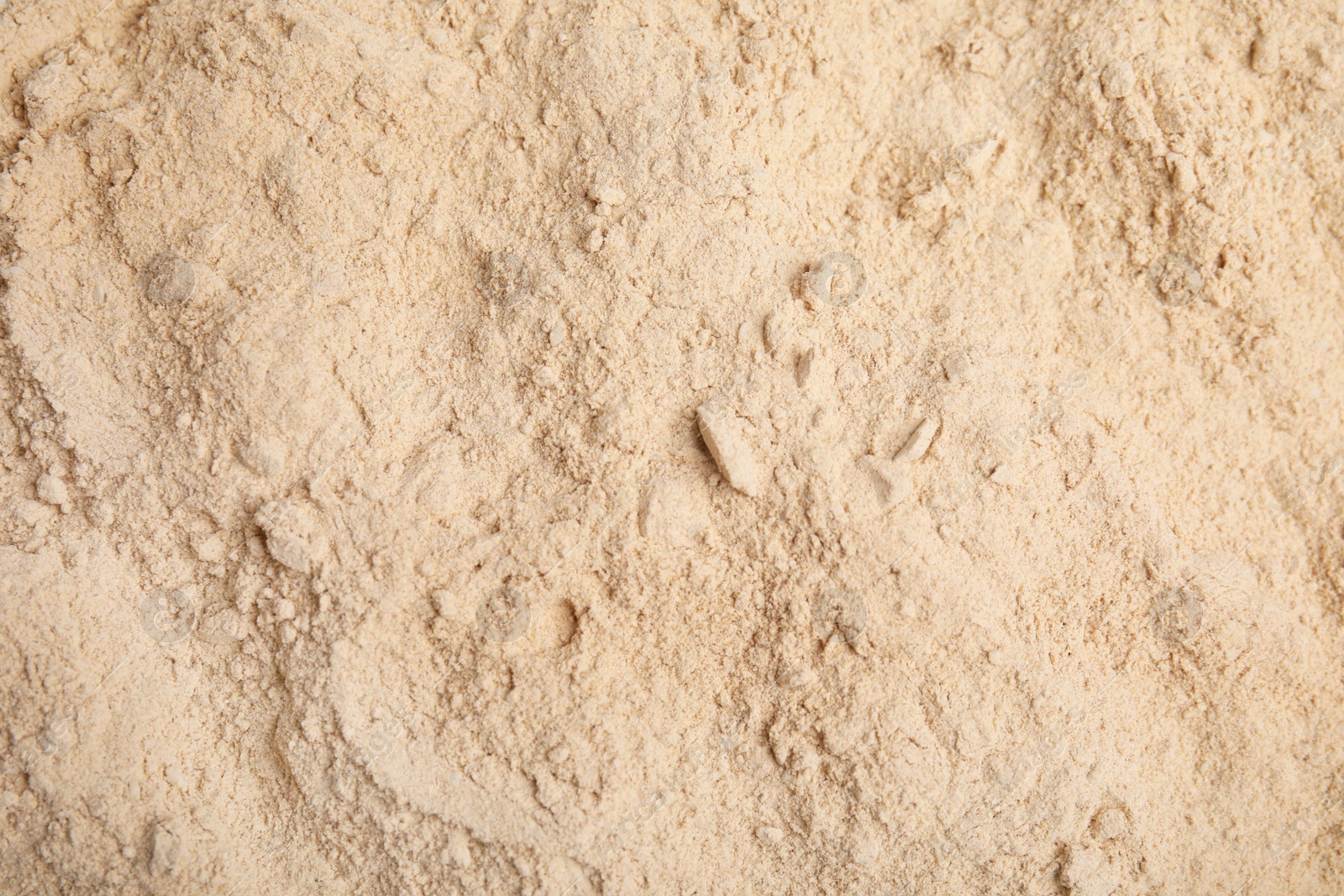 Photo of Pile of sesame flour as background, top view