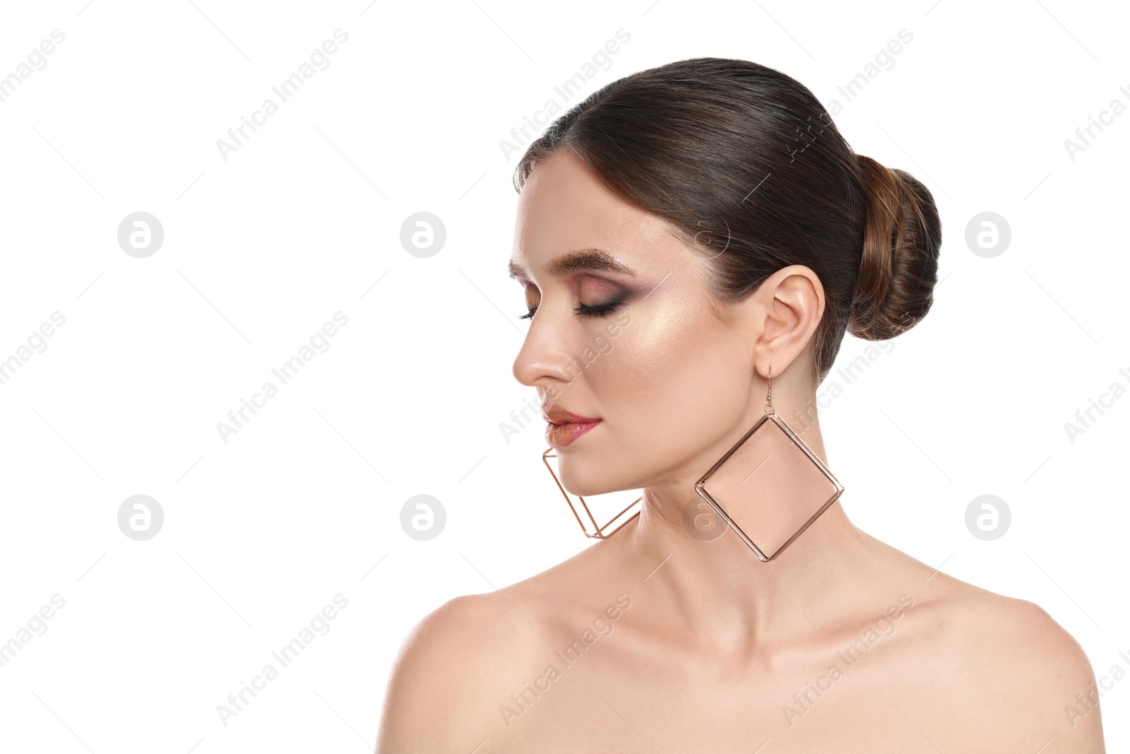 Photo of Beautiful young woman with glitter makeup on white background