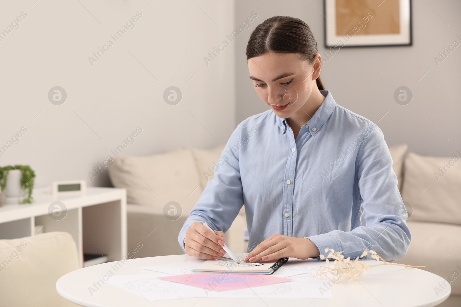 Photo of Astrologer making fate forecast at table indoors, space for text. Fortune telling