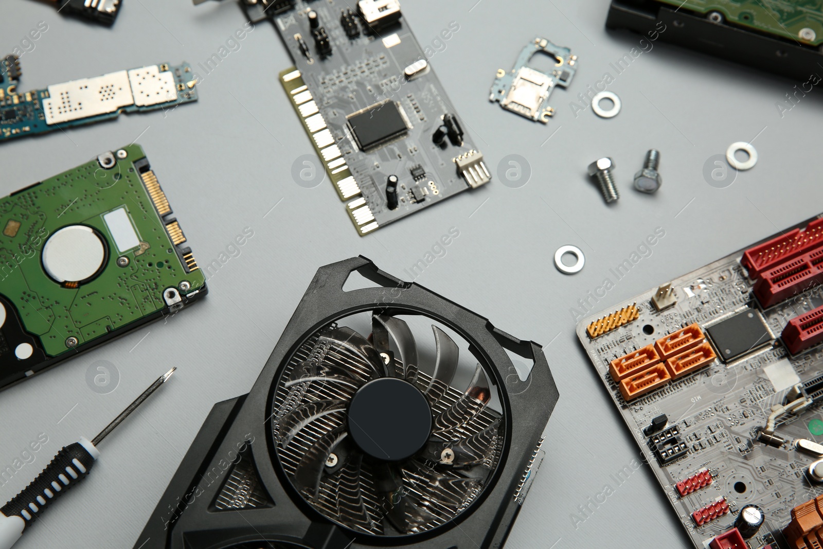 Photo of Graphics card and other computer hardware on light background, above view