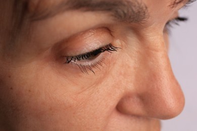 Skin care. Senior woman on white background, closeup