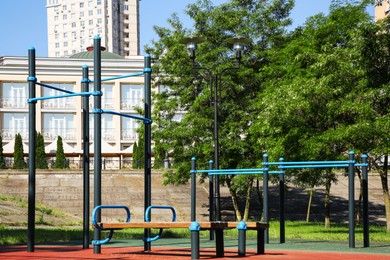 Empty outdoor gym with exercise equipment in park
