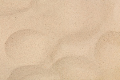 Photo of Dry beach sand as background, top view