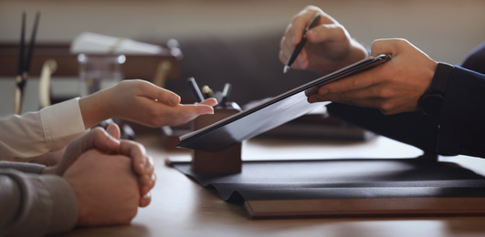 Image of Male lawyer working with clients in office, closeup. Banner design