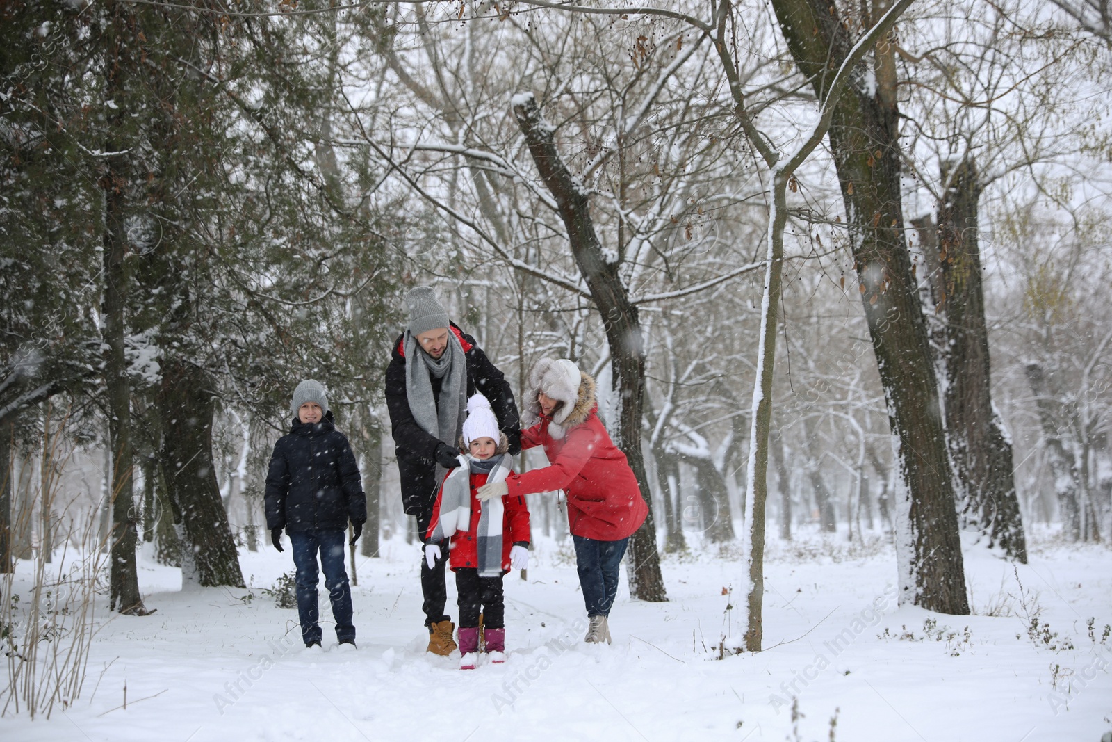 Photo of Family spending time outside on winter day. Christmas vacation