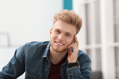 Photo of Portrait of handsome young man in room