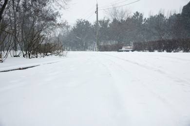 Photo of City street covered with snow in winter