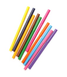 Photo of Many bright markers isolated on white, top view