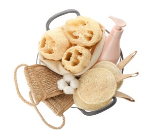 Photo of Set of toiletries with natural loofah sponges in basket isolated on white, top view
