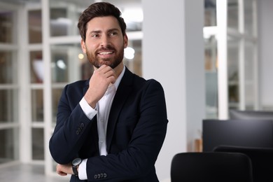 Photo of Portrait of smiling man in office, space for text. Lawyer, businessman, accountant or manager