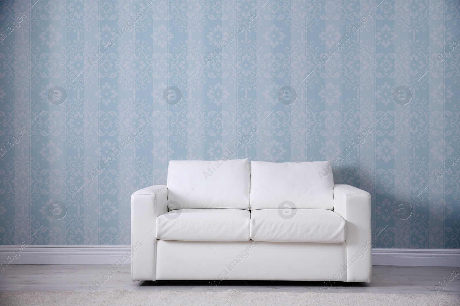 Image of Modern sofa near patterned wallpapers. Interior design 