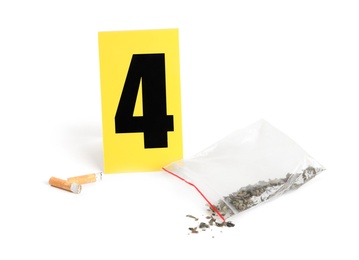 Photo of Cigarette stubs, cannabis and crime scene marker with number four isolated on white