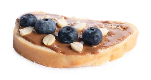 Photo of Toast with tasty nut butter, blueberries and peanuts isolated on white