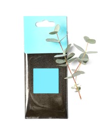 Photo of Scented sachet and eucalyptus branches on white background, top view