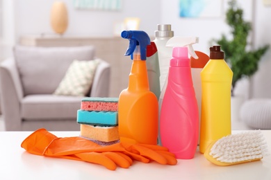 Photo of Set of cleaning supplies on table indoors