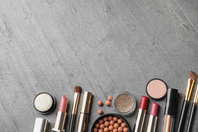 Photo of Set of luxury makeup products and space for text on grey background, flat lay