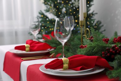 Photo of Beautiful table setting with Christmas decor indoors