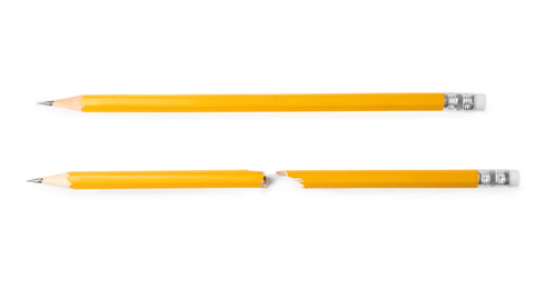 Photo of Broken and whole graphite pencils on white background, top view
