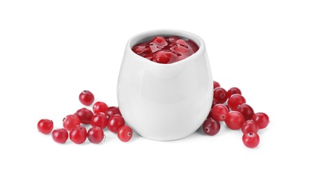 Photo of Cranberry sauce in pitcher and fresh berries isolated on white