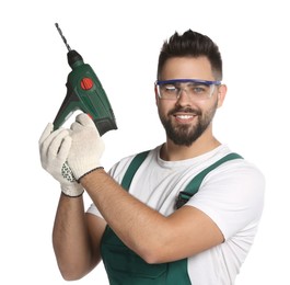 Photo of Young worker in uniform with power drill on white background