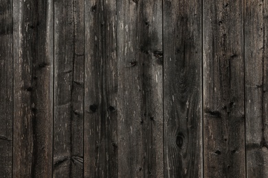 Photo of Texture of dark wooden surface as background, closeup view